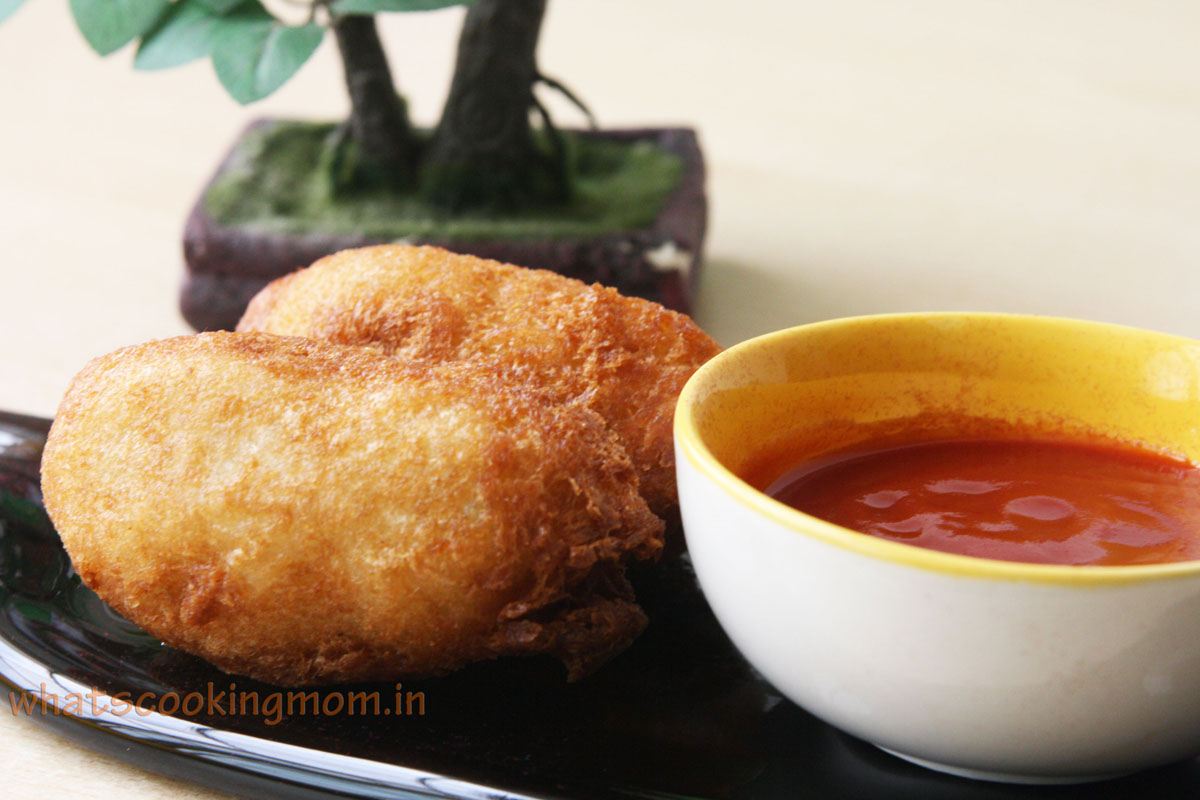 Potato stuffed Bread roll served with ketchup
