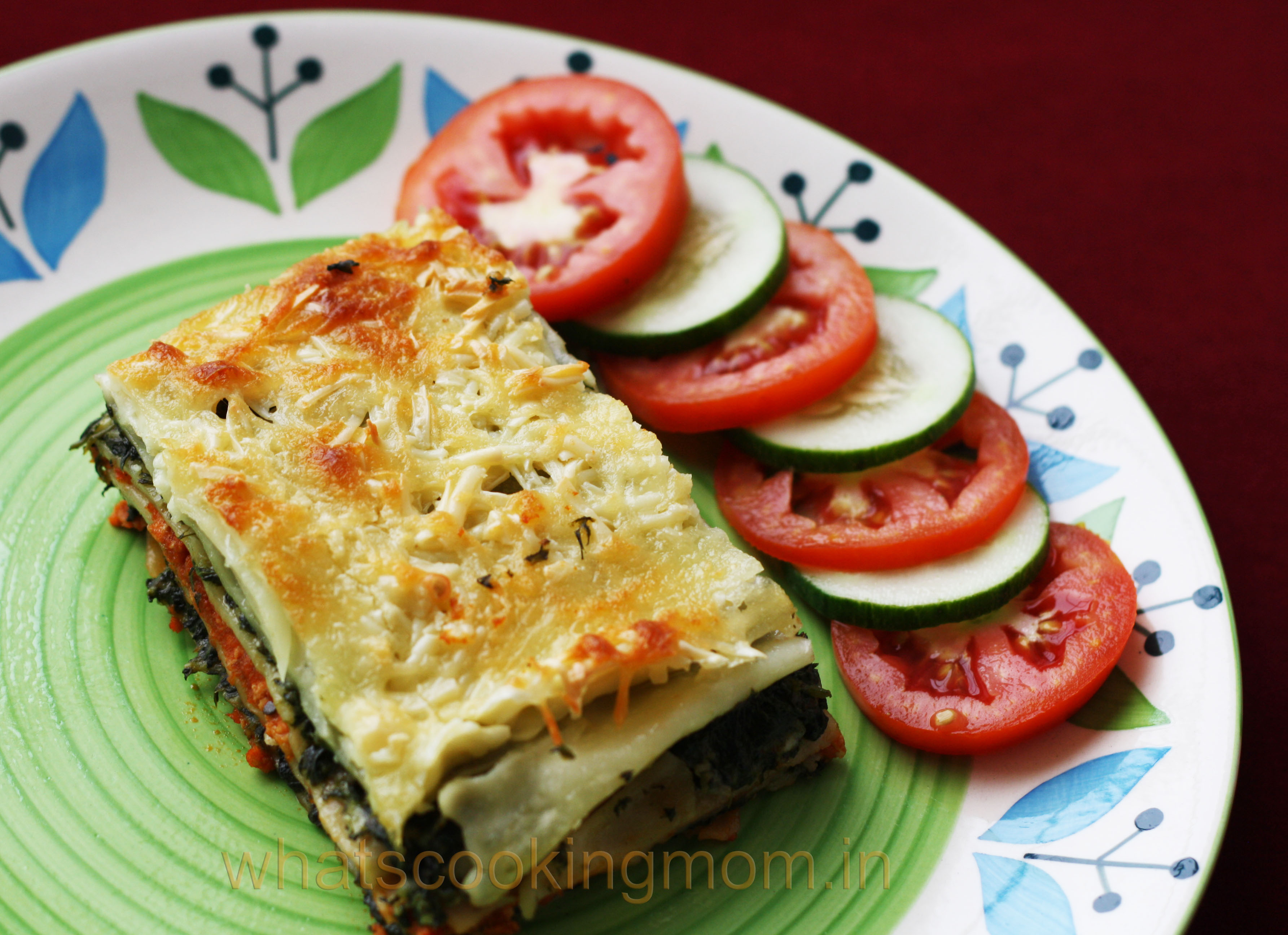Vegetarian Spinach Lasagna with salad served on a plate