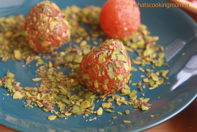 Vegan Dessert  Turkish Carrot truffles in a plate coated with slivered pistachio