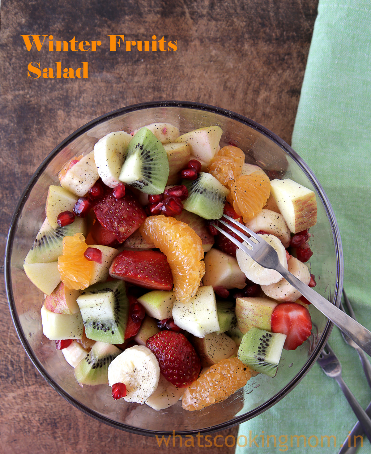 Winter Fruits Salad served in a glass bowl with fork